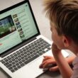 A Child watching Youtube videos on a laptop computer