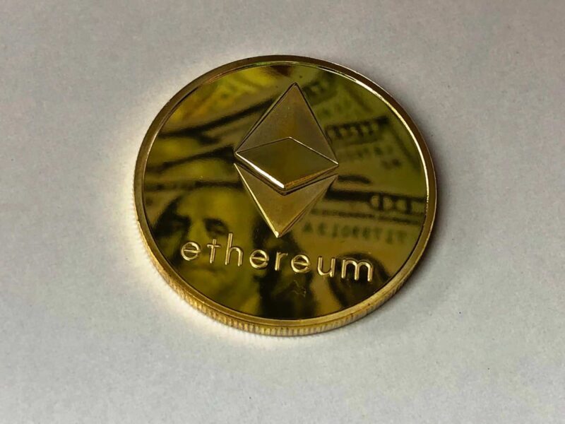 round gold colored ethereum ornament